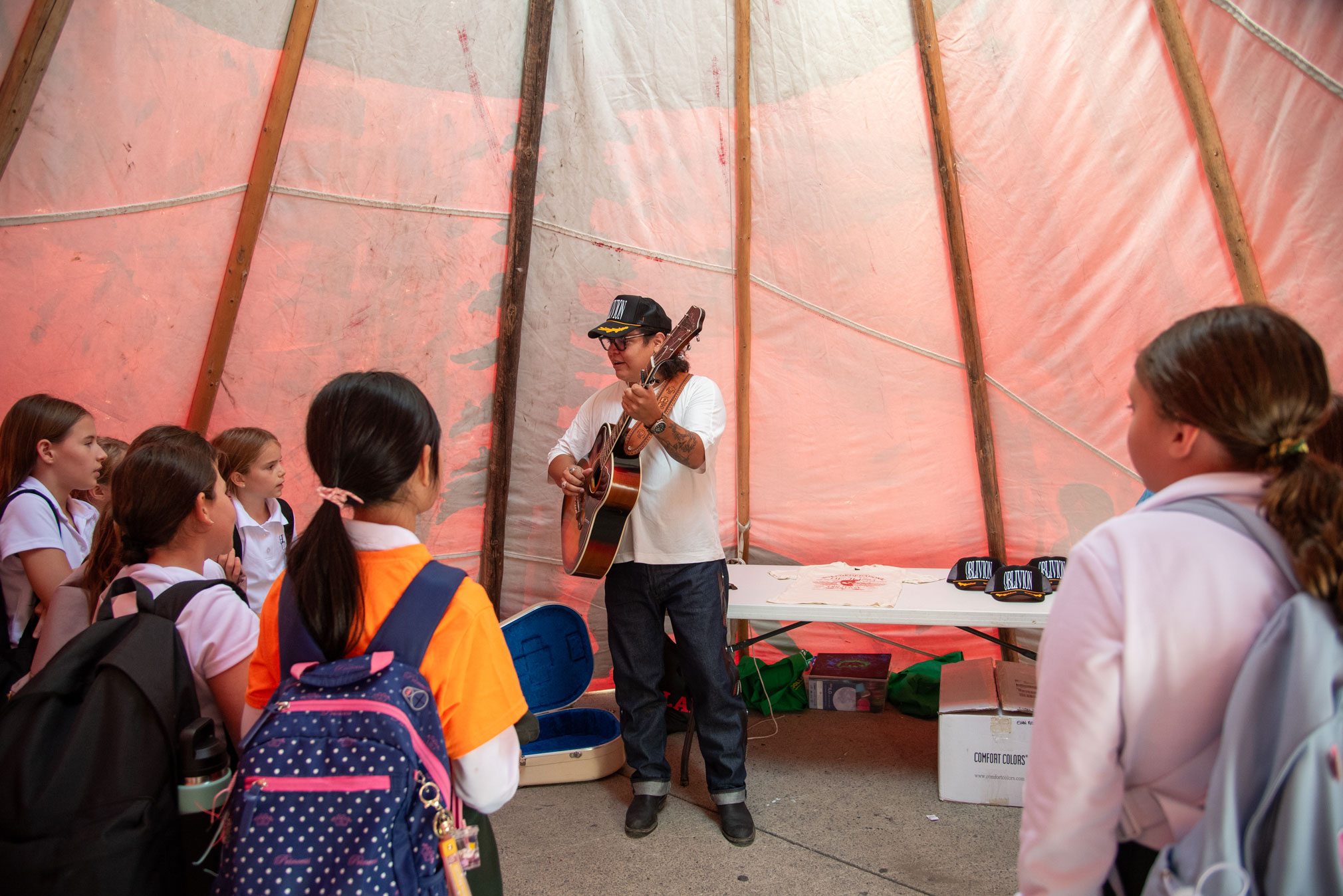 Evan Redsky performs for a young audience at ILG.