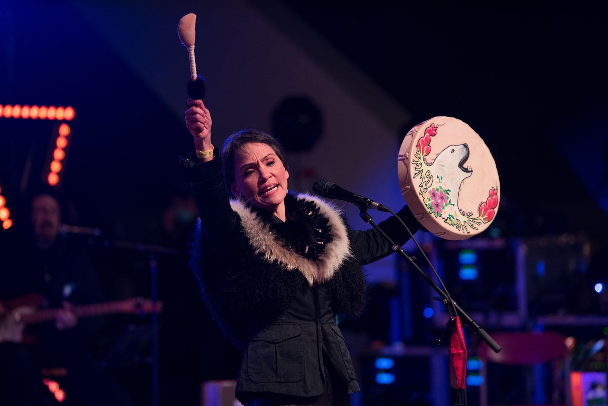 Susan Aglukark raises her drum in the air during ILG's Mainstage finale.